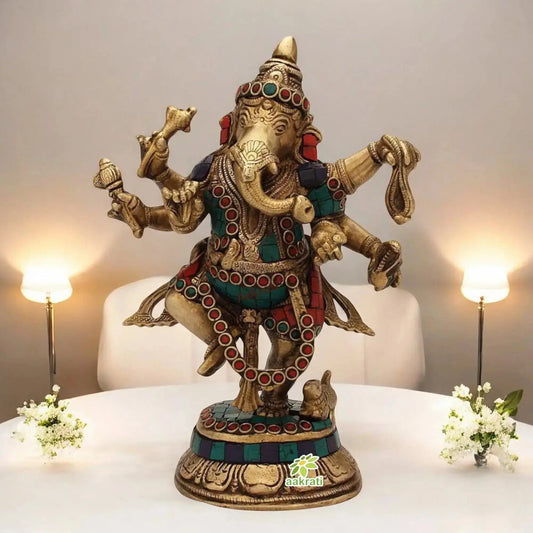 Turquoise inlaid dancing brass Ganesha figurine on a modern console table