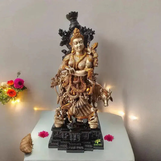 “Luxurious brass Radha Krishna-inspired idol with cow, representing devotion and traditional Indian artistry