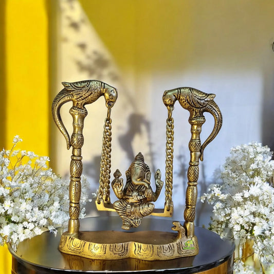 Brass Ganesha Idol on Swing | Perfect Home Decor for Prosperity and Peace | Handmade Decorative Ganesha Murti ( Yellow, 8 inch) Aakrati