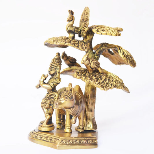 Elegant statue of Lord Krishna playing flute under tree with cow Decorative Showpiece Aakrati