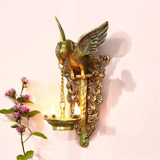 Brass made bird holding oil lamp wall diya/wall decor Aakrati