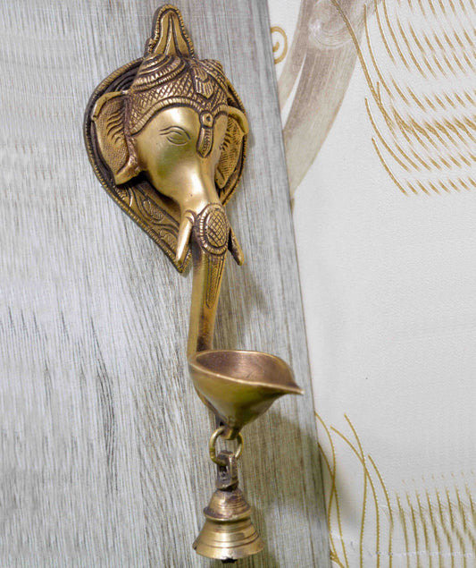 Aakrati Wall Hanging Decorative Ganesha face with diya and bell Showpiece with Bell- 21 Cm