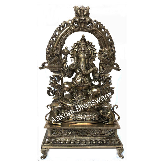 Lord Ganesha Sitting on a decorative throne hand carved brass statue Aakrati