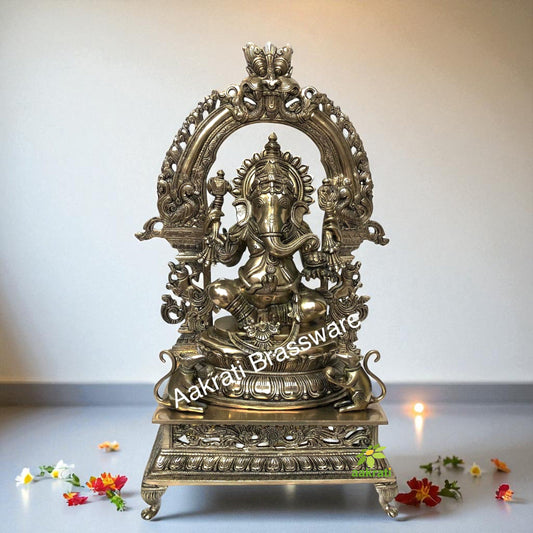 Lord Ganesha Sitting on a decorative throne hand carved brass statue Aakrati