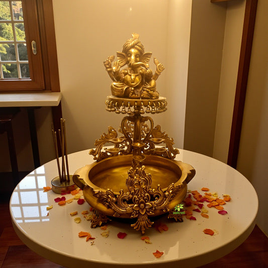 Brass made event decor floating candle stand - Urli with Lord Ganesha figure on it Aakrati