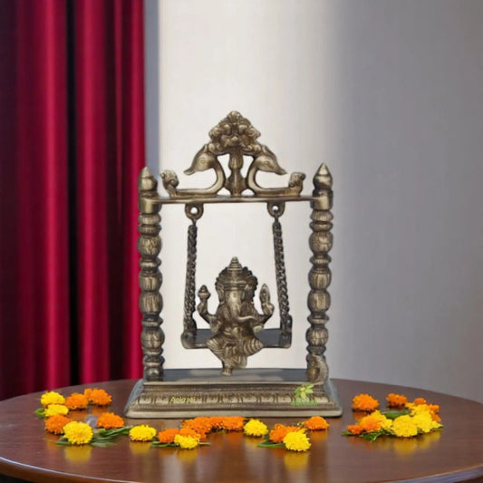 Brass Ganesha on Jhula Showpiece | Perfect Spiritual Accent for Your Home or Temple | Handcrafted Brass Ganesha on Jhula ( Yellow, 10 inch) Aakrati