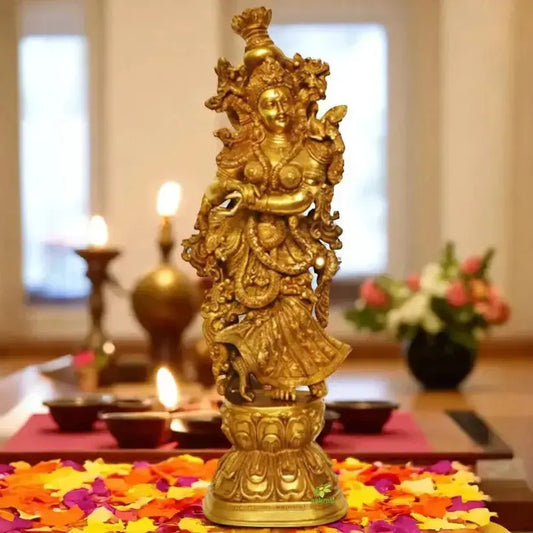 “Elegant brass Radha murti placed in a serene living space, symbolizing devotion, beauty, and spiritual ambiance.”