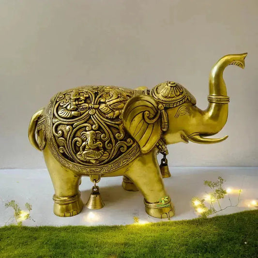 Brass elephant statue with raised trunk