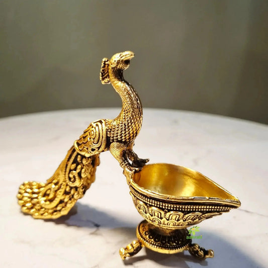 Decorative brass peacock diya for home temple