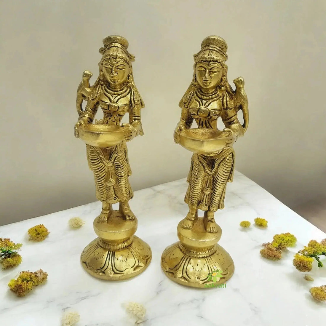 Brass Deep Lakshmi lady idol placed in a modern home interior symbolizing peace and prosperity