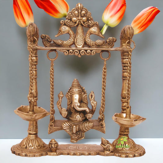 Brass Ganesha Swing with Oil Lamp with Peacock Design