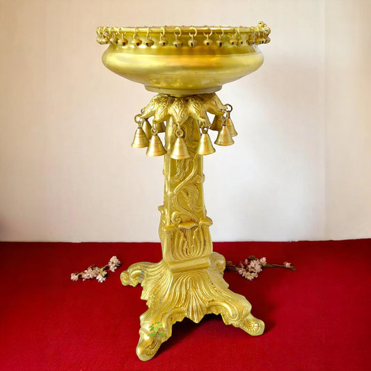 Brass Urli stand with small ghungroos bells antiuqe finish