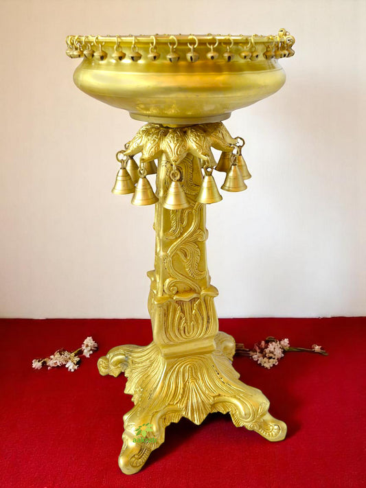 Brass Urli stand with small ghungroos bells antiuqe finish