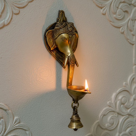 Aakrati Wall Hanging Decorative Ganesha face with diya and bell Showpiece with Bell- 21 Cm