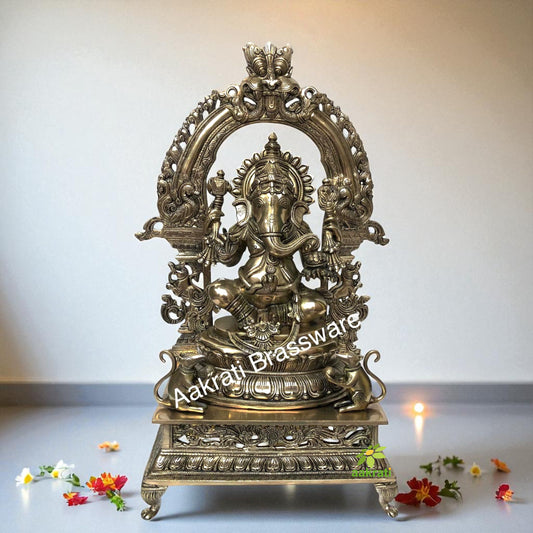 Lord Ganesha Sitting on a decorative throne hand carved brass statue