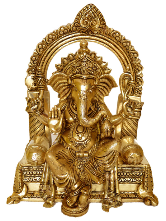 Lord Ganesha sitting on a decorated chowki brass made Pooja ghar home decor statue