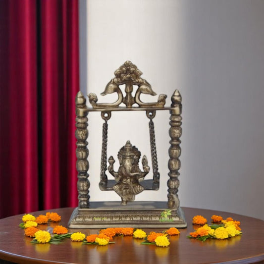 Brass Ganesha on Jhula Showpiece | Perfect Spiritual Accent for Your Home or Temple | Handcrafted Brass Ganesha on Jhula ( Yellow, 10 inch)