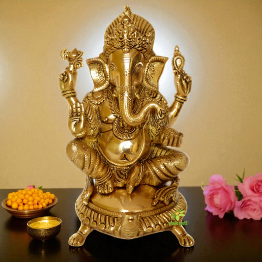 God Ganesha sitting on a decorated chowki brass made Pooja ghar home decor statue